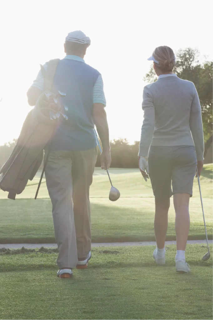husband & wife on golf course